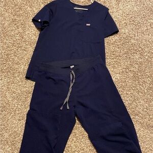 Pants large TALL. Shirt large. Excellent condition